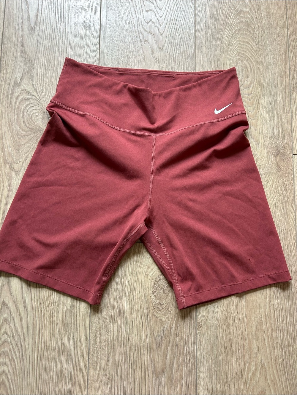 Orange Nike dri-fit bicycle shorts